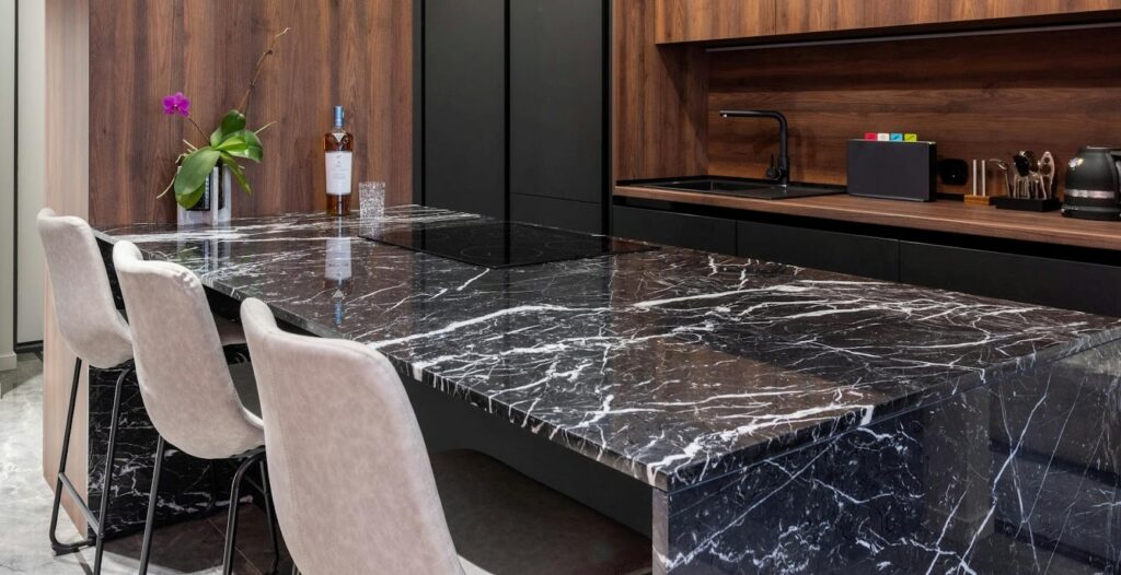 Luxurious Calacatta marble countertop with golden veins for elegant kitchen interiors.