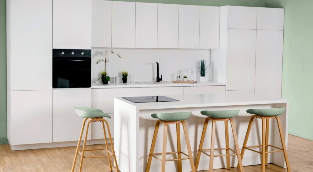 Bright white kitchen cabinets in a Sarasota remodel, creating a spacious and inviting atmosphere.